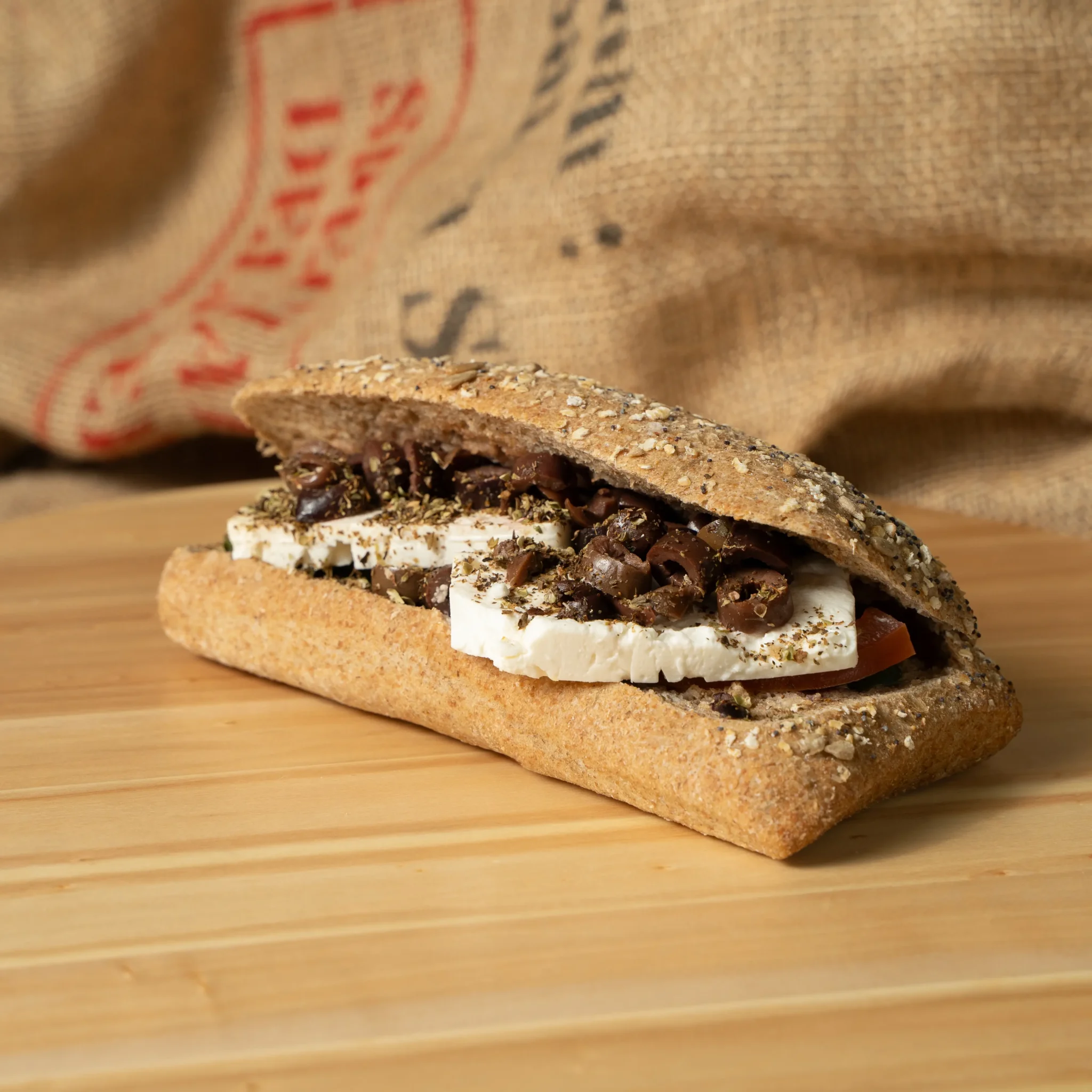 Sandwich with feta cheese, olive oil and olives